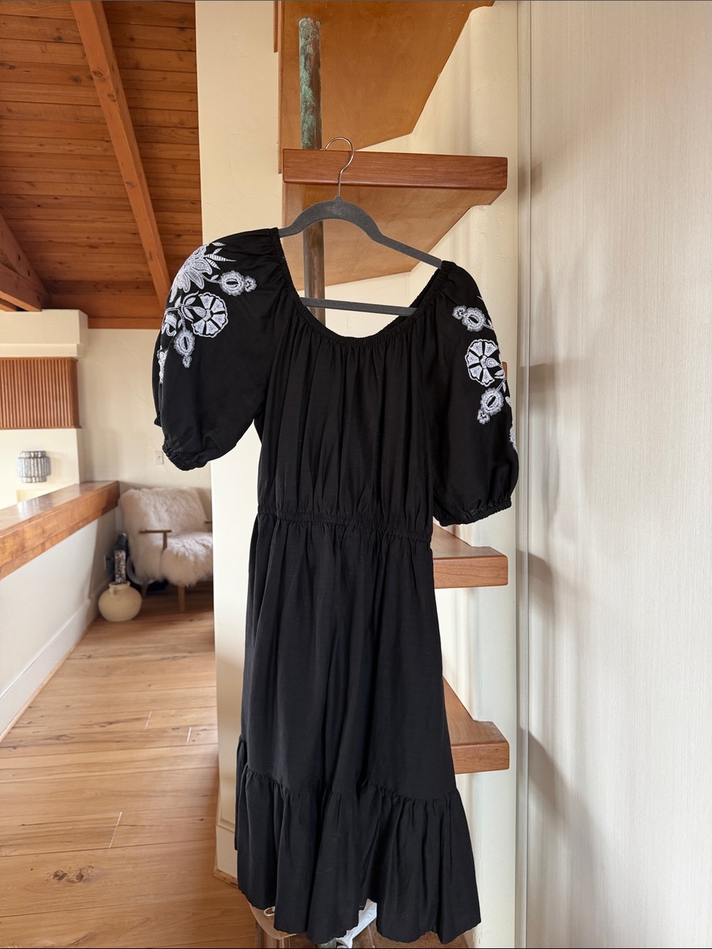 Black dress with embroidered sleeves